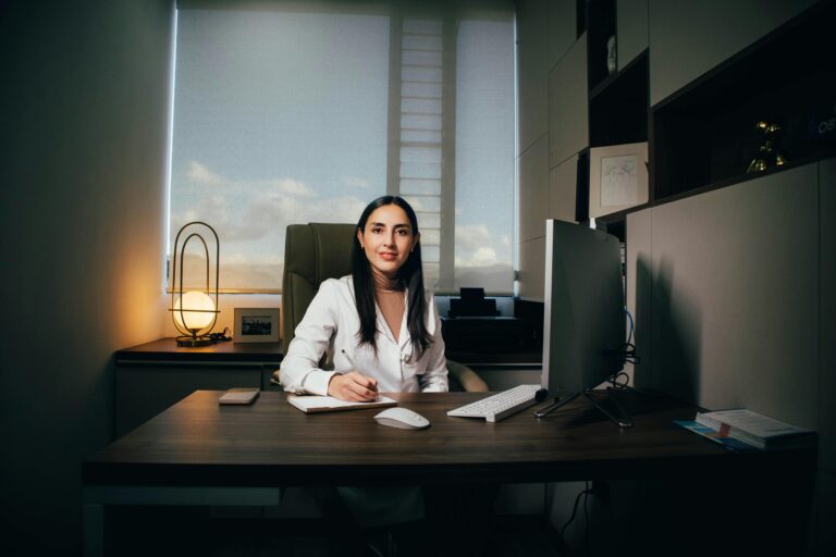 confident woman working at office with wealth mindset and positive affirmations