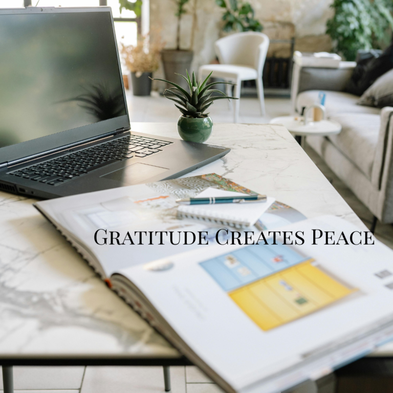 Minimal desk with plants and soft sunlight representing gratitude, calm, and a positive mindset for a peaceful life.