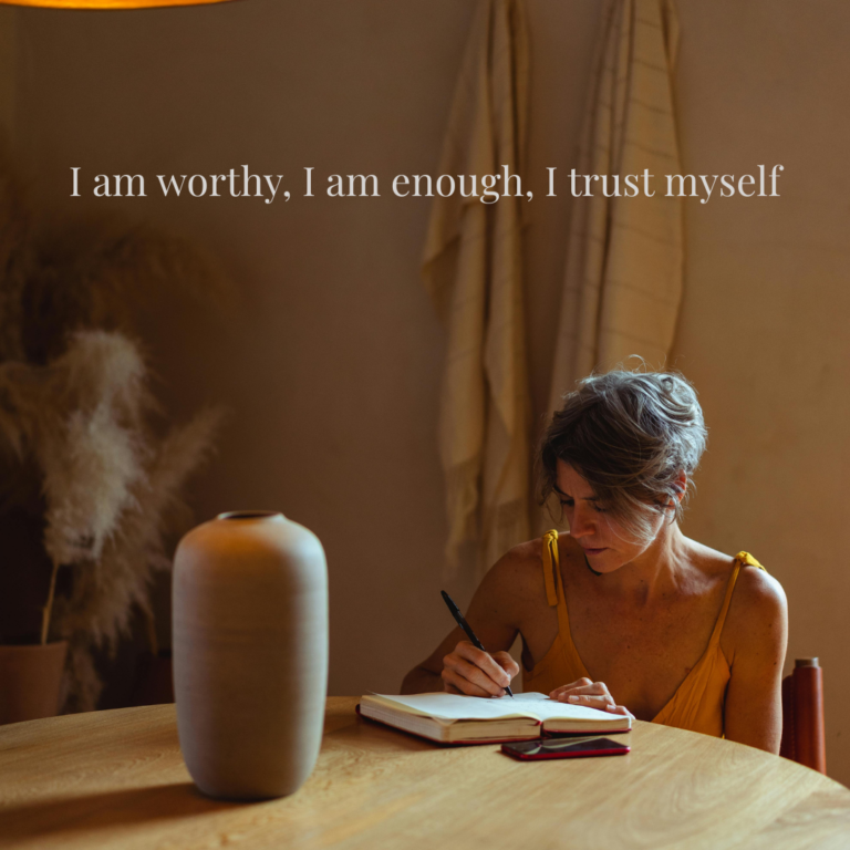 woman writing in journal practicing gentle self worth affirmations for emotional strength and healing